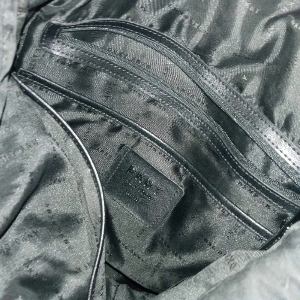 DKNY RAISED RAINBOW LETTER HEAVYWEIGHT DRAWSTRING BACPACK W MULTIPLE POCKETS
